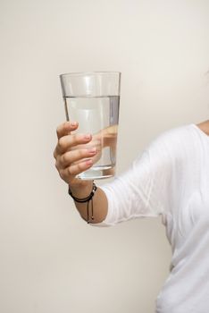 hand holding a glass of water