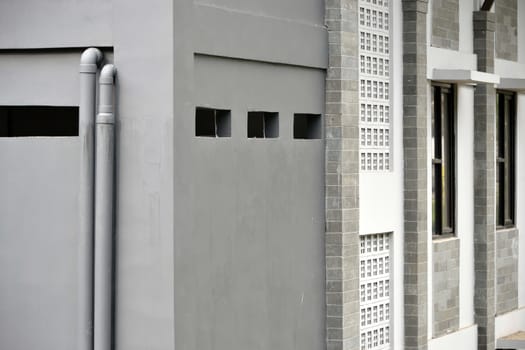 grey concret wall that built on residential building