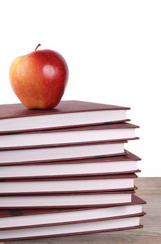 Book with apple isolated on white  background