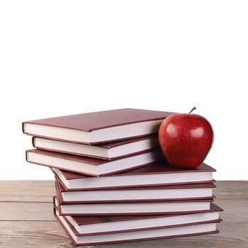 Book with apple isolated on white  background