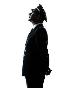 one  man in airline pilot uniform in studio isolated on white background silhouette