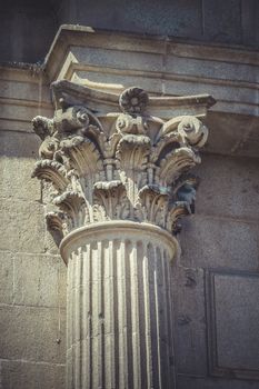 Rock, Corinthian capitals, stone columns in old building in Spain