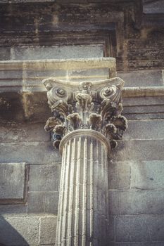 Stonework, Corinthian capitals, stone columns in old building in Spain
