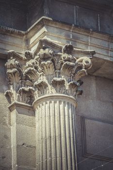 Ionic, Corinthian capitals, stone columns in old building in Spain