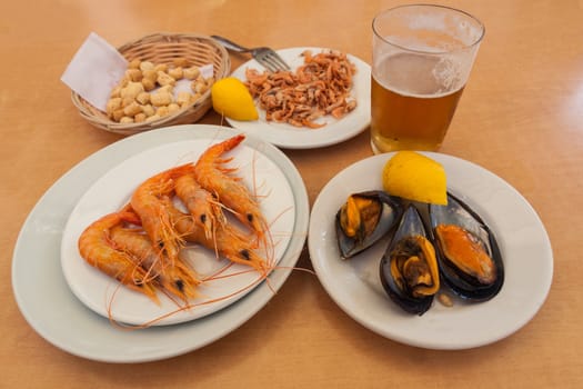 Mussels, shrimps and croutons with glass of beer