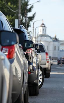 Street with long row of cars parked in St. Petersburg 