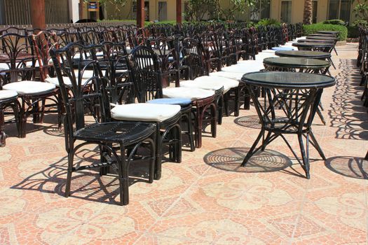  Terrace with tables and chairs on sunny day