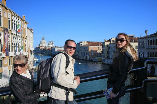 Family posing on the bridge in Venice,Italy