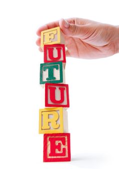 Building blocks being stacked to create the word future 