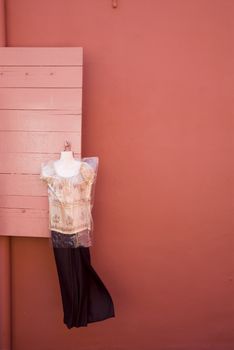 A dress hung from a window in Melaka, Malaysia