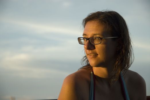 An attractive woman enjoying the sun shine in the tropics