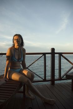 An attractive woman enjoying the sun shine in the tropics