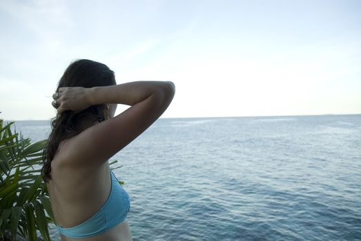 An attractive woman enjoying the sun shine in the tropics