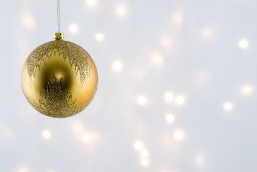 Christmas Decorations against a background lit with christmas lights