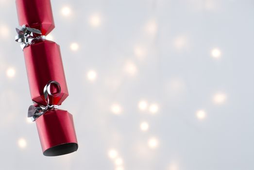 Christmas Decorations against a background lit with christmas lights