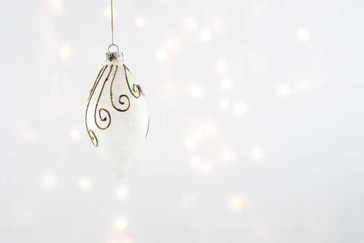 Christmas Decorations against a background lit with christmas lights