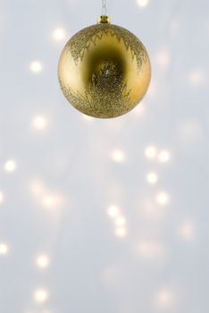 Christmas Decorations against a background lit with christmas lights