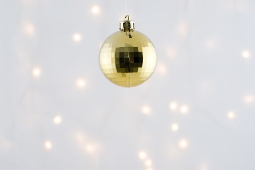 Christmas Decorations against a background lit with christmas lights