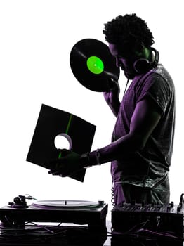one disc jockey man holding vinyl disc in silhouette on white background