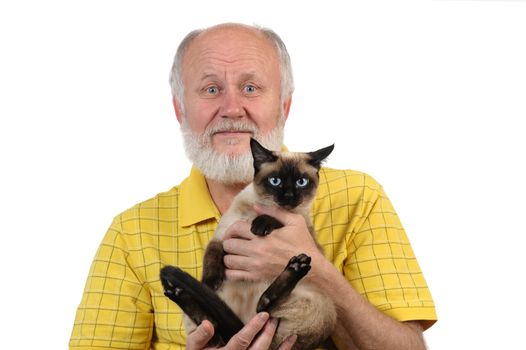 senior balding man in yellow shirt holding siamese cat