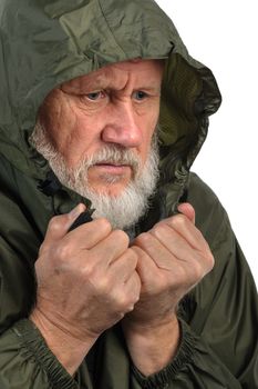 pathetic senior man in green waterproof jacket