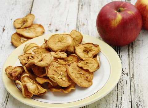 tasty homemade dried apples on the wooden table