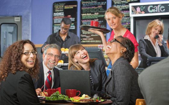 Coffee house barista serving laughing business people