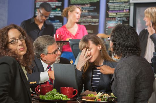 Disappointed white collar workers together in cafeteria