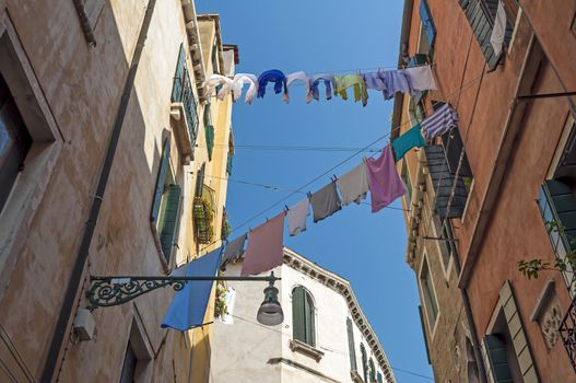 Cloth drying rope in quiet street of Venice, Italy.