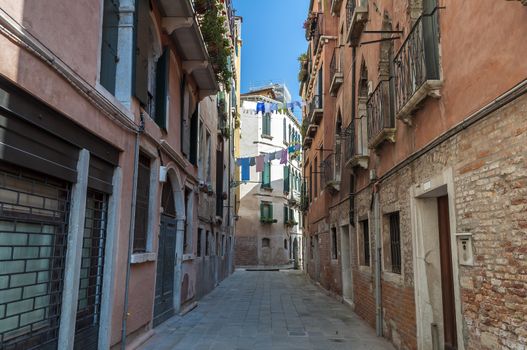 Residential buildings along quiet street in Venice, Italy.