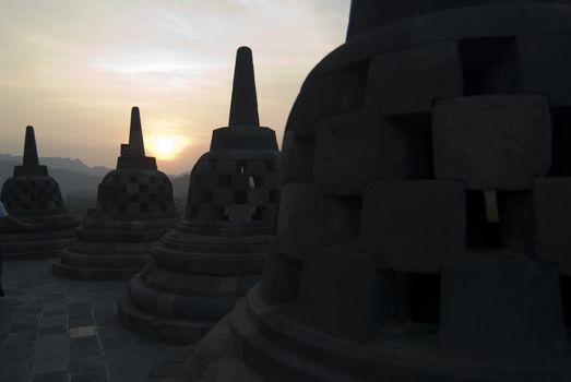 The sun setting over Borobudur Temple