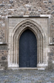 Detailed view of a medieval cathedral door.