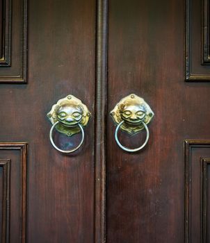 Wooden chinese door with a lion head. 