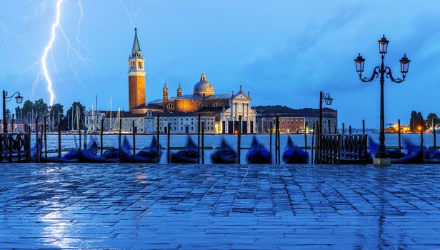 Gondolas floating in the Grand Canal after sunset 