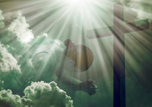 Woman praying at the cross