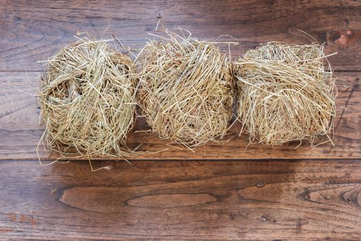 hay on grunge wooden background.