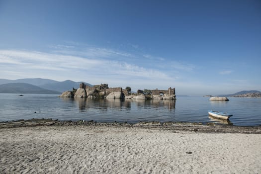 Lake Bafa Nature Park in Turkey, near Aegean Sea. Ancient Greek city Heraclea ruins can be seen all around the lake. 