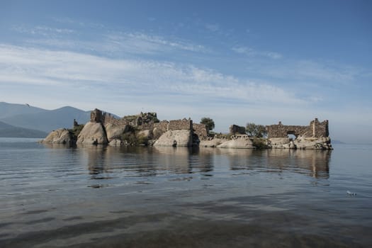 Lake Bafa Nature Park in Turkey, near Aegean Sea. Ancient Greek city Heraclea ruins can be seen all around the lake. 