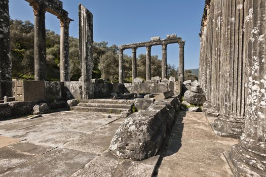 The Temple of Zeus at Euromos is to me the perfect ruined Greek temple.  Set in a forest of olive trees just east of the D525 highway between Selcuk (Ephesus) and Bodrum (25 km/16 miles SE of Lake Bafa, 13 km/8 miles NW of Milas), just south of the village of Selimiye (map), the Corinthian temple almost looks like a Hollywood set, except it's for real.  A shrine may have existed here from the 6th century BCE.  Believed to date from the time of Emperor Hadrian (117-138 CE), the Temple of Zeus Lepsynus and its precinct were excavated by Turkish archeologists starting in 1969. Look carefully and you'll see that some of the columns are unfluted, meaning perhaps that the temple was never finished.  Located about a mile south of the village of Selimiye, the temple area has no services, although there may be a villager selling cold drinks.  Stop for a half-hour's look if you're driving south from ?zmir or Ephesus headed for Milas, Bodrum or Marmaris.  This is actually a much larger archeological site than just the temple. The hillside to the east is littered with ruins, and if you spend an hour hiking around you can find a theater, an agora and massive defensive walls.