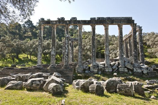 The Temple of Zeus at Euromos is to me the perfect ruined Greek temple.  Set in a forest of olive trees just east of the D525 highway between Selcuk (Ephesus) and Bodrum (25 km/16 miles SE of Lake Bafa, 13 km/8 miles NW of Milas), just south of the village of Selimiye (map), the Corinthian temple almost looks like a Hollywood set, except it's for real.  A shrine may have existed here from the 6th century BCE.  Believed to date from the time of Emperor Hadrian (117-138 CE), the Temple of Zeus Lepsynus and its precinct were excavated by Turkish archeologists starting in 1969. Look carefully and you'll see that some of the columns are unfluted, meaning perhaps that the temple was never finished.  Located about a mile south of the village of Selimiye, the temple area has no services, although there may be a villager selling cold drinks.  Stop for a half-hour's look if you're driving south from ?zmir or Ephesus headed for Milas, Bodrum or Marmaris.  This is actually a much larger archeological site than just the temple. The hillside to the east is littered with ruins, and if you spend an hour hiking around you can find a theater, an agora and massive defensive walls.