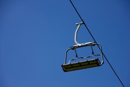 Lonely chairlift on blue sky