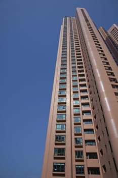 Tall residential tower block in the city of Hong Kong, China