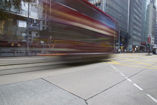 Tram crossing a road junction on Hong Kong Island in Hong Kong