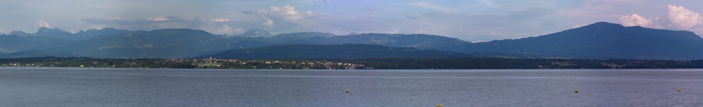 Panoramic view of Alps mountains upon Geneva lake by cloudy weather, Switzerland