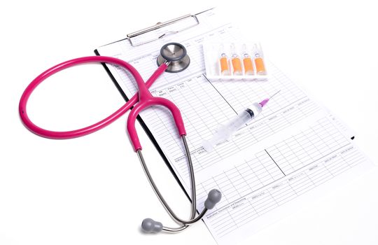 ampule syringe and stethoscope on white table