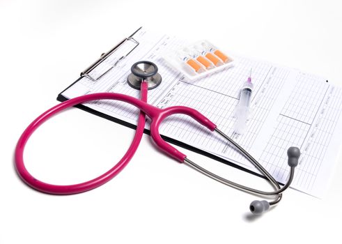 ampule syringe and stethoscope on white table