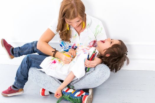 Cute, adorable boy with mother on the floor