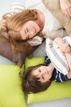 Cute, adorable boy with mother on the floor