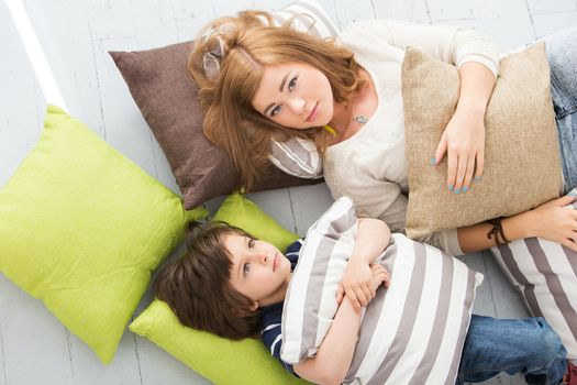 Cute, adorable boy with mother on the floor