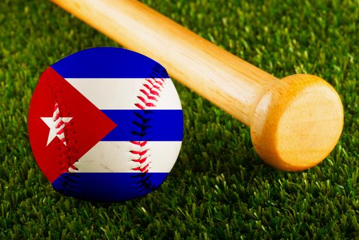 Baseball with Cuba flag and bat over a background of green grass
